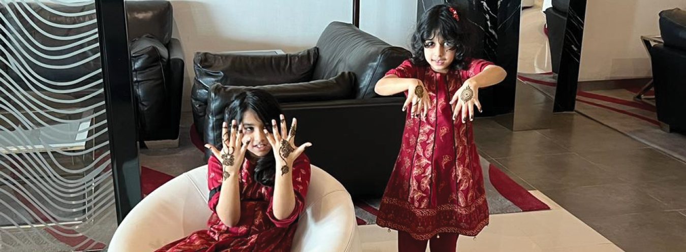 Beautiful henna designs, family celebrating Eid
